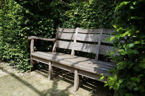 Benches are nestled within the hedges to provide opportunities for repose.