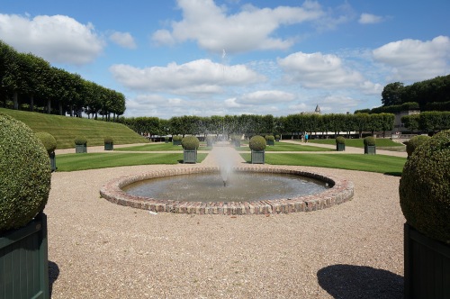 The circular fountains are plainly edged with brick.